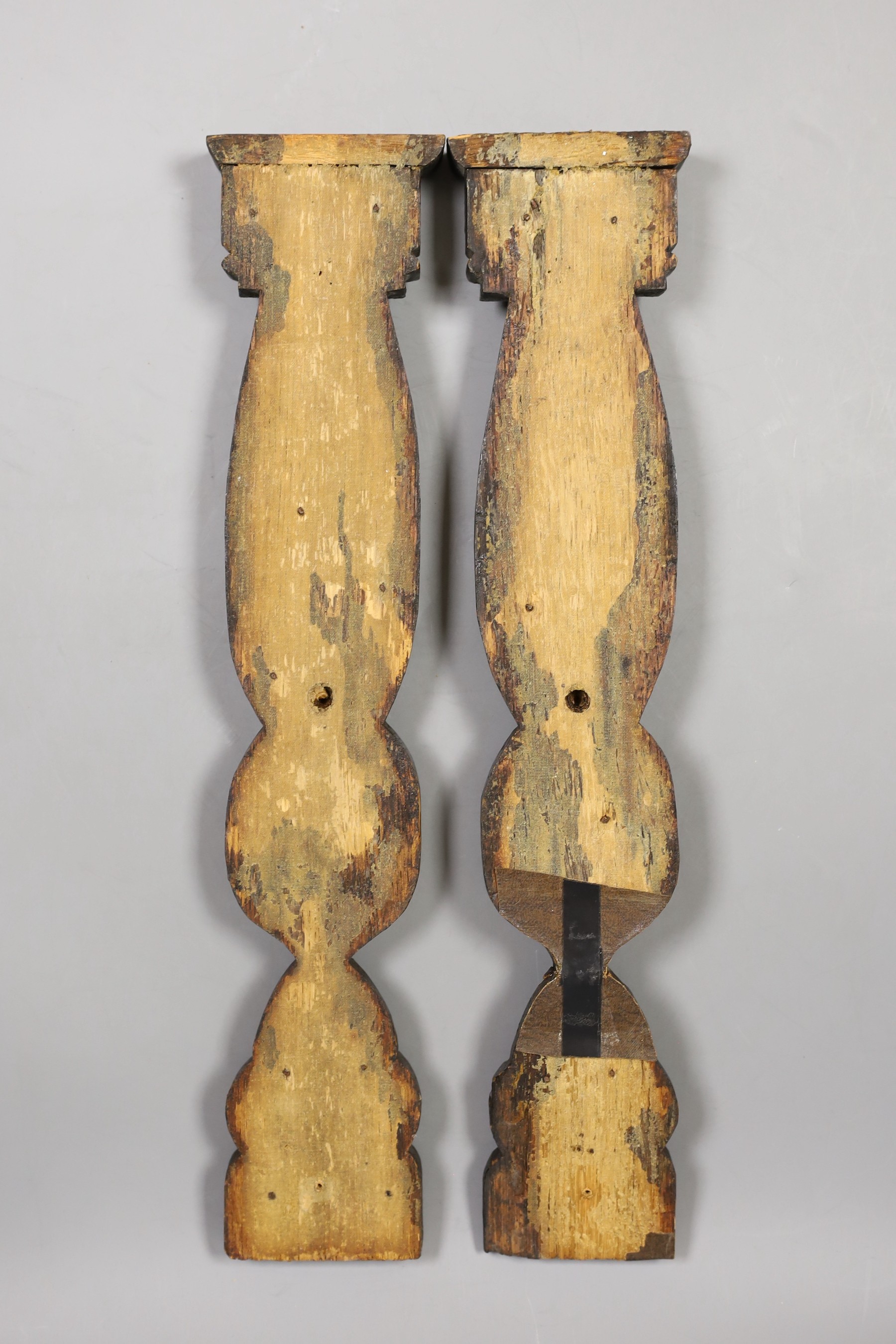 A pair of 17th century carved oak fragments, 39cm